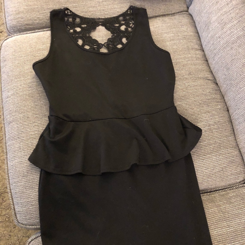 Black above the knee mini dress. Scalloped waist.